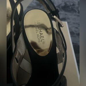 Black genuine leather Micheal Kors wedge sandal  size 10.  Worn